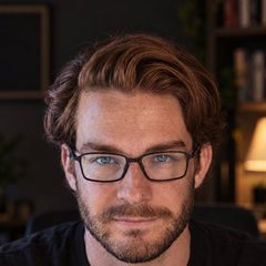 Kai, an AI-generated character with auburn hair and glasses